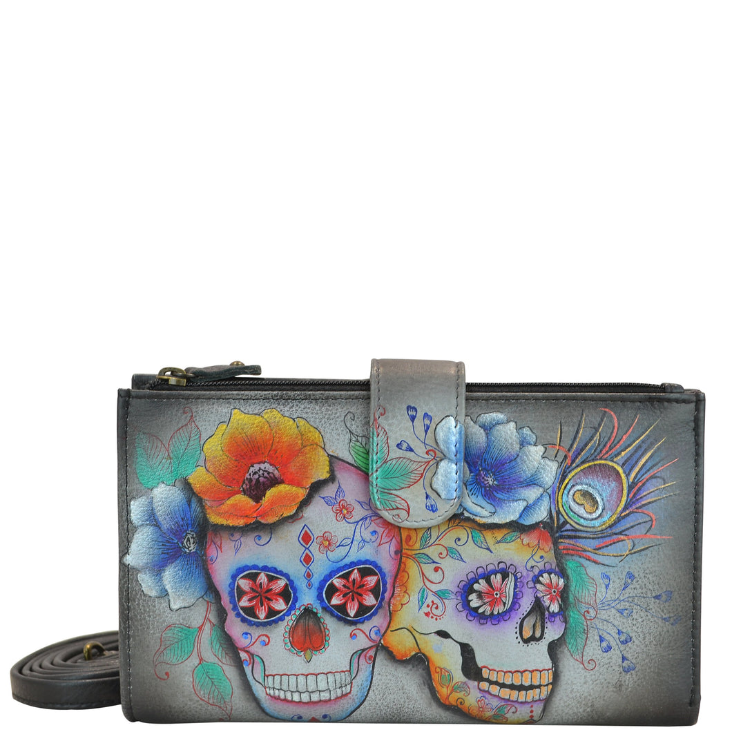 Anuschka style 1113, handpainted Cell Phone Case & Wallet. Calaveras de Azucar painting in Multi color. Featuring twelve credit card holders, two ID windows, two slip-in multipurpose pockets and one full length bill pocket.