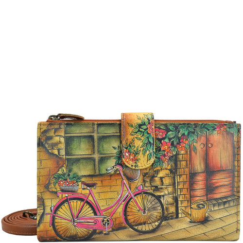 Anuschka style 1113, handpainted Cell Phone Case & Wallet. Vintage Bike painting in tan color. Featuring twelve credit card holders, two ID windows, two slip-in multipurpose pockets and one full length bill pocket.