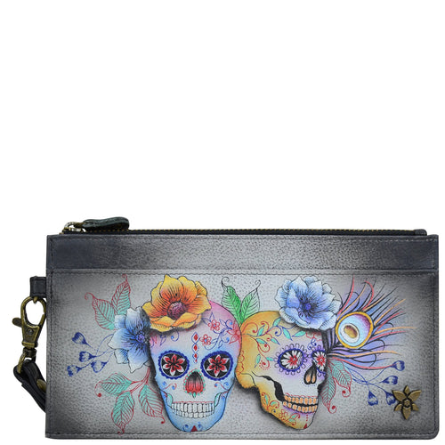 Anuschka style 1151, handpainted Clutch Organizer Wristlet. Calaveras de Azucar painting in black color. Featuring Rear six credit card holders with RFID protection.