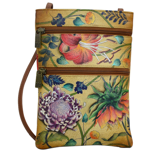 Anuschka style 448, handpainted Mini Double Zip Travel Crossbody. Caribbean Garden Painted in Tan Color. Featuring main compartment with magnetic closure and key holder.