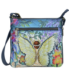 Load image into Gallery viewer, Anuschka style 550, handpainted Expandable Travel Crossbody. Enchanted Garden Painted in Blue Color. Featuring inside one full length zippered wall pocket, one open wall pocket, two multipurpose pockets.
