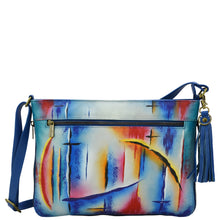 Load image into Gallery viewer, Anuschka style number 616, Expandable Crossbody. Northern Skies painting in blue color.
