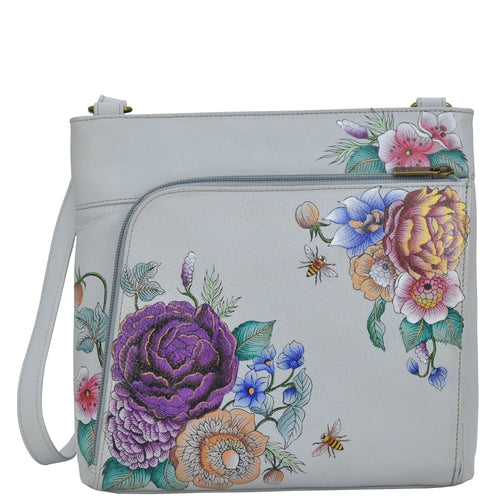 Anuschka style 651, handpainted Crossbody With Front Zip Organizer. Floral Charm painting in grey color. Fits Tablet and E-Reader. Featuring RFID blocking.