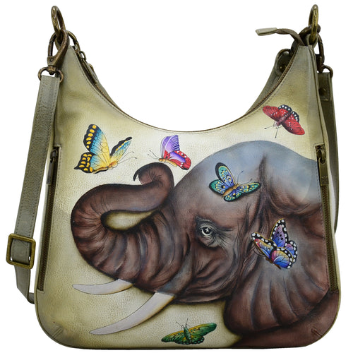 Anuschka style 662, handpainted Convertible Slim Hobo With Crossbody Strap. Gentle Giant Painted in Multi Color. Featuring inside zippered wall pocket, one open wall pocket, two multipurpose pockets with gusset and rear full length zippered pocket, slip in cell pocket.