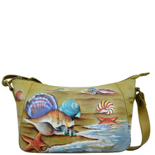 Load image into Gallery viewer, Anuschka style 670, handpainted Everyday Shoulder Hobo. Gift of the Sea Painted in Multi Color. Featuring inside one zippered wall pocket, two multipurpose pockets, rear full length zippered pocket with adjustable shoulder strap.
